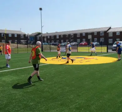 Man checking the Quality Synthetic Grass is Made