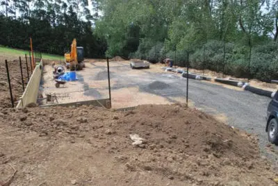 Turning a rough rural paddock with a steep slope into a tennis court