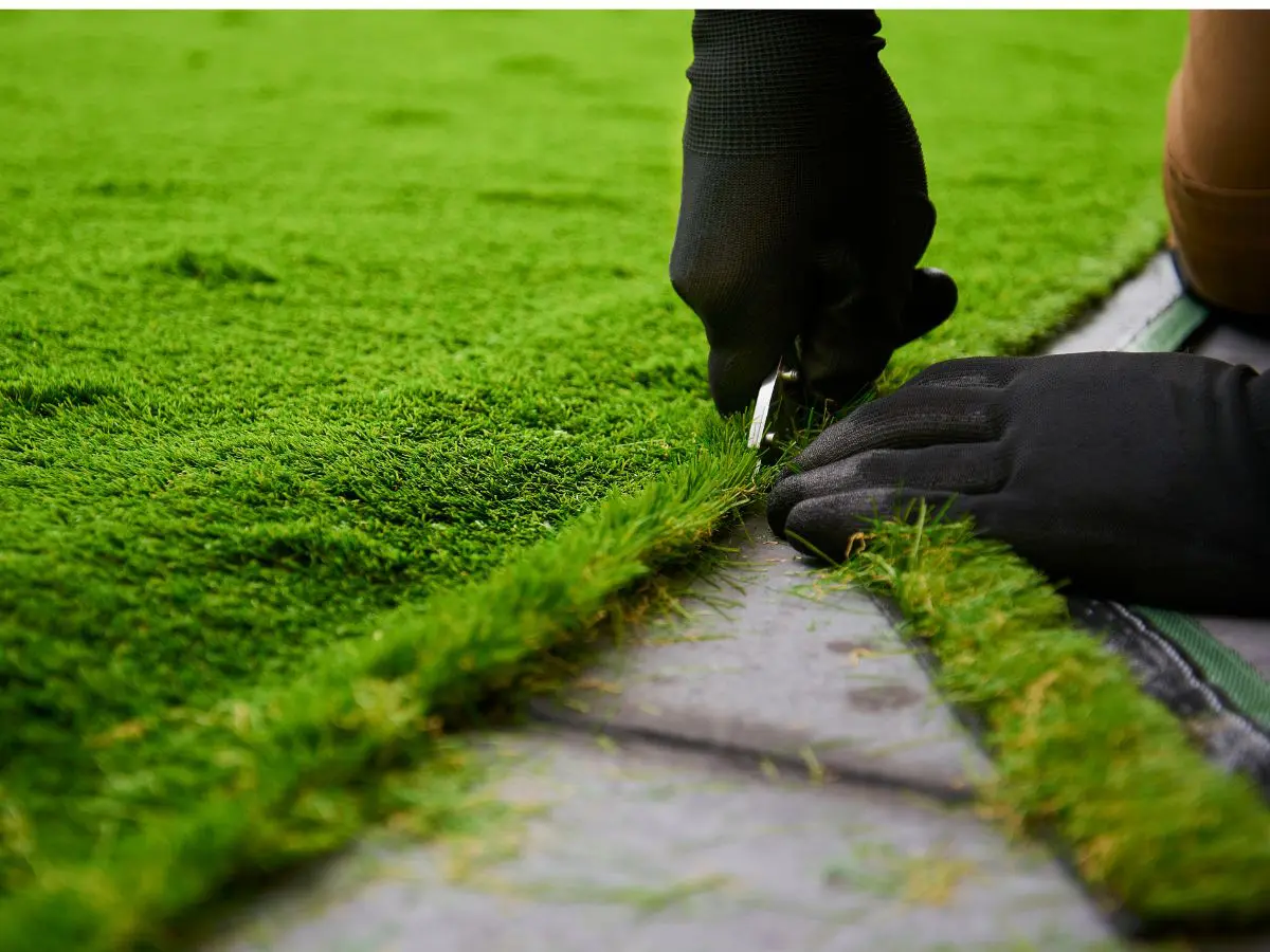 artificial grass being cut
