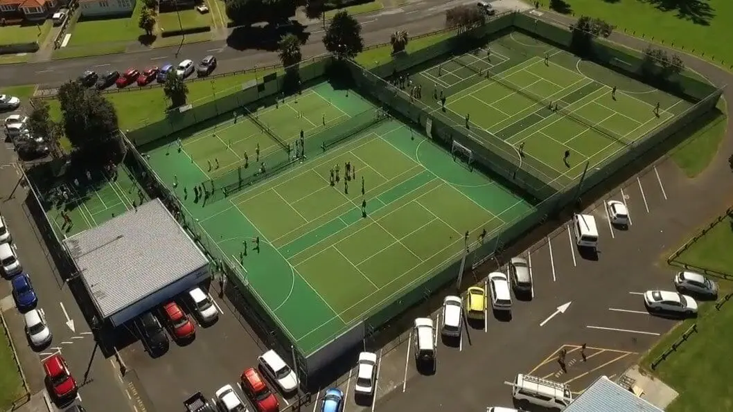 Playing surfaces for hockey, football, netball, and futsal, on courts