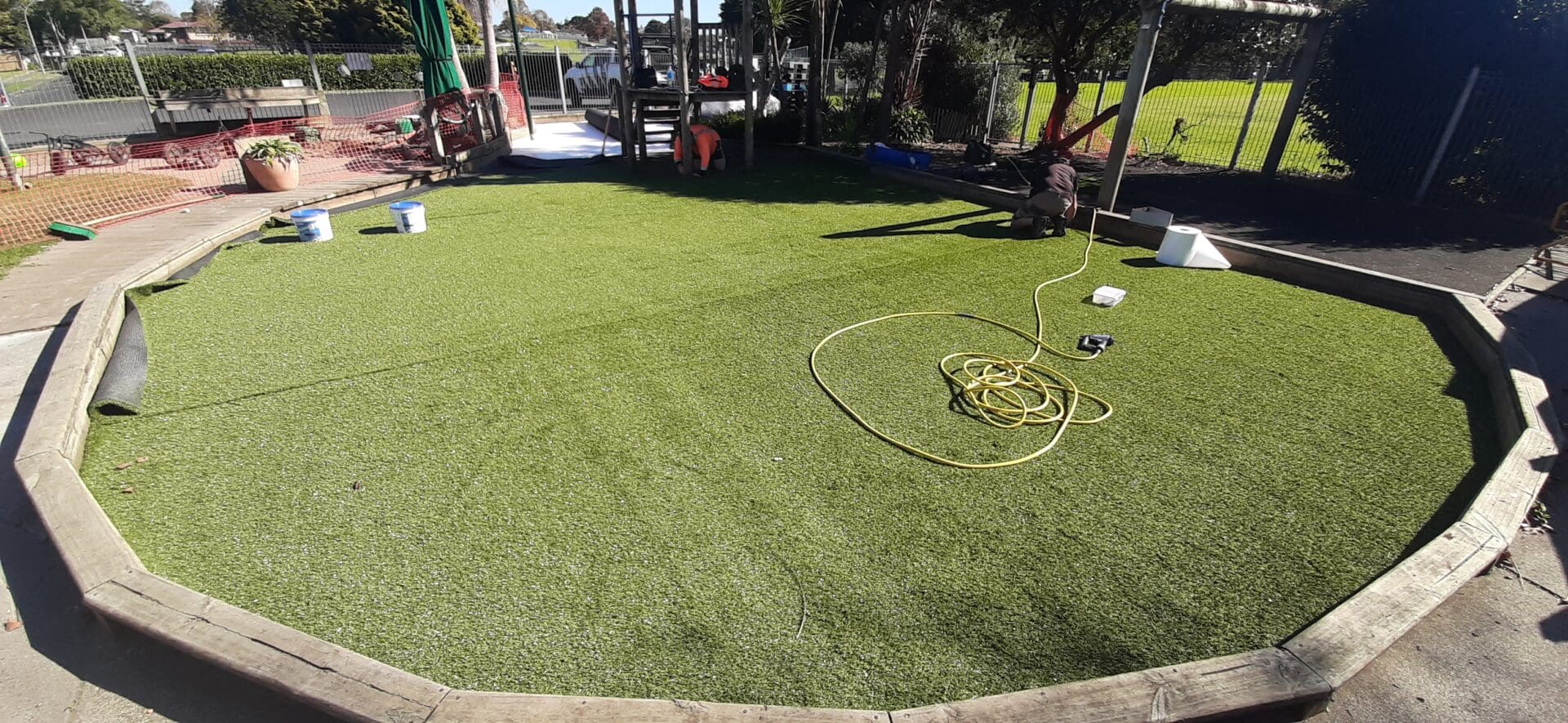 TigerTurf 35mm PowerPlay shock pads beneath TigerTurf playgrounds for safe play