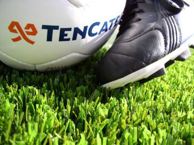Football shoes, ball and grass