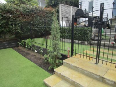 Another view of Westmere beautiful backyard with artificial grass installed made by TigerTurf New Zealand