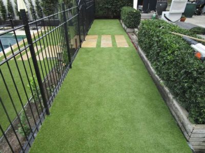 View of beautiful Westmere backyard artificial grass installed by TigerTurf New Zealand